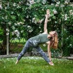 yoga pose in front of roses