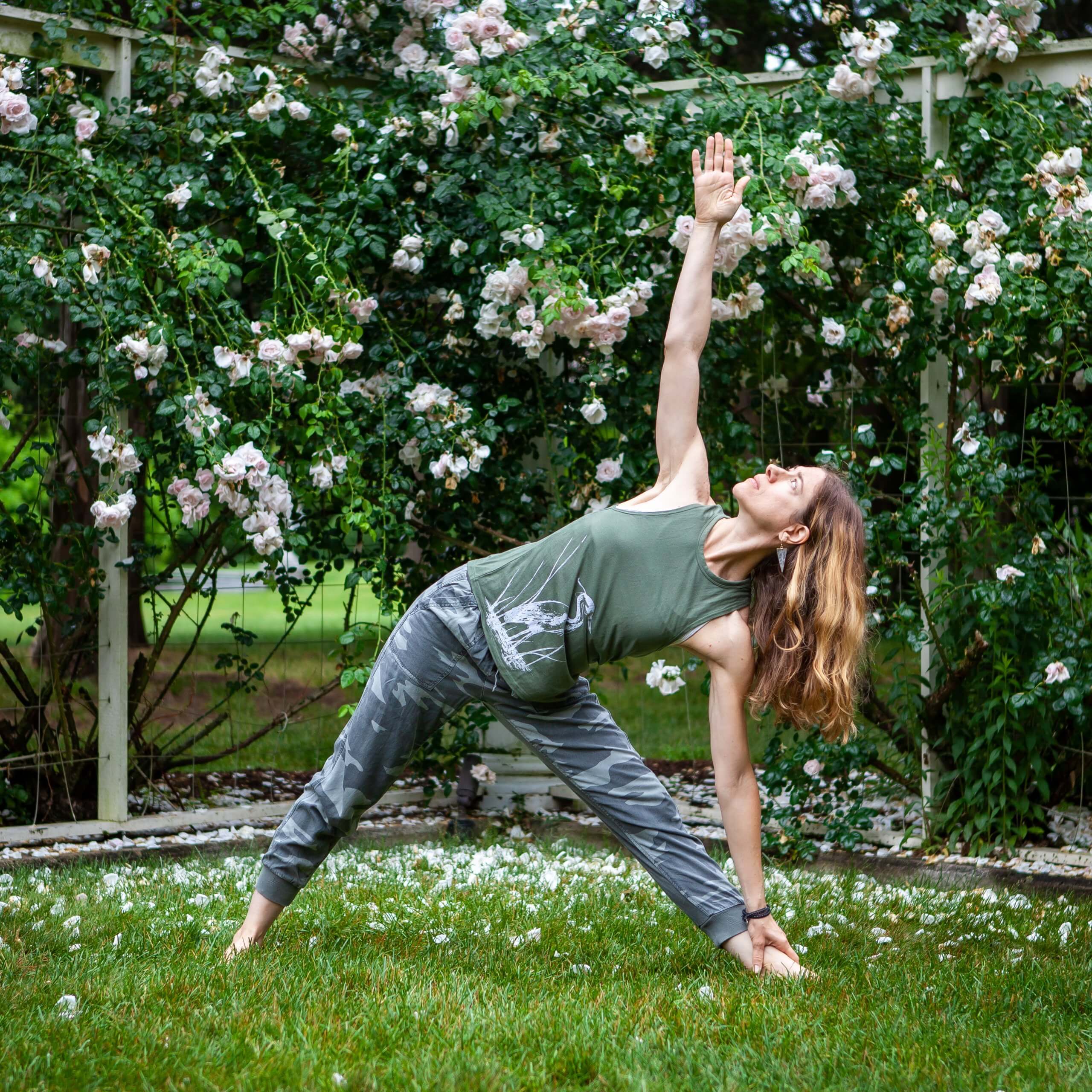 yoga pose in front of roses