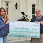 Owner of Starr Mill Yoga presents check to Rockfall